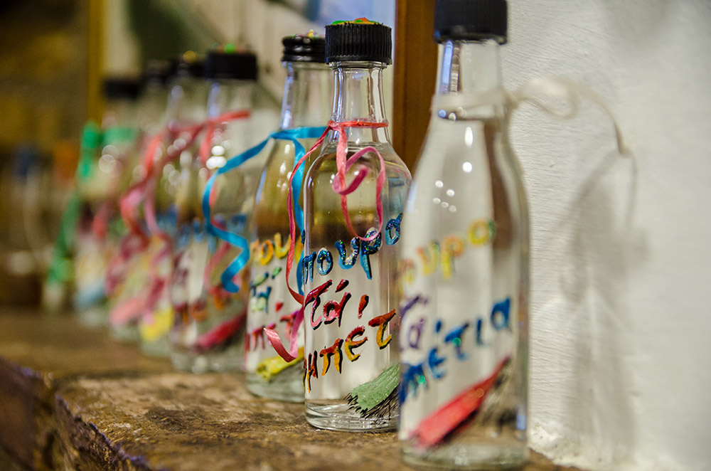 Hand-painted bottles carrying old Athenian verses