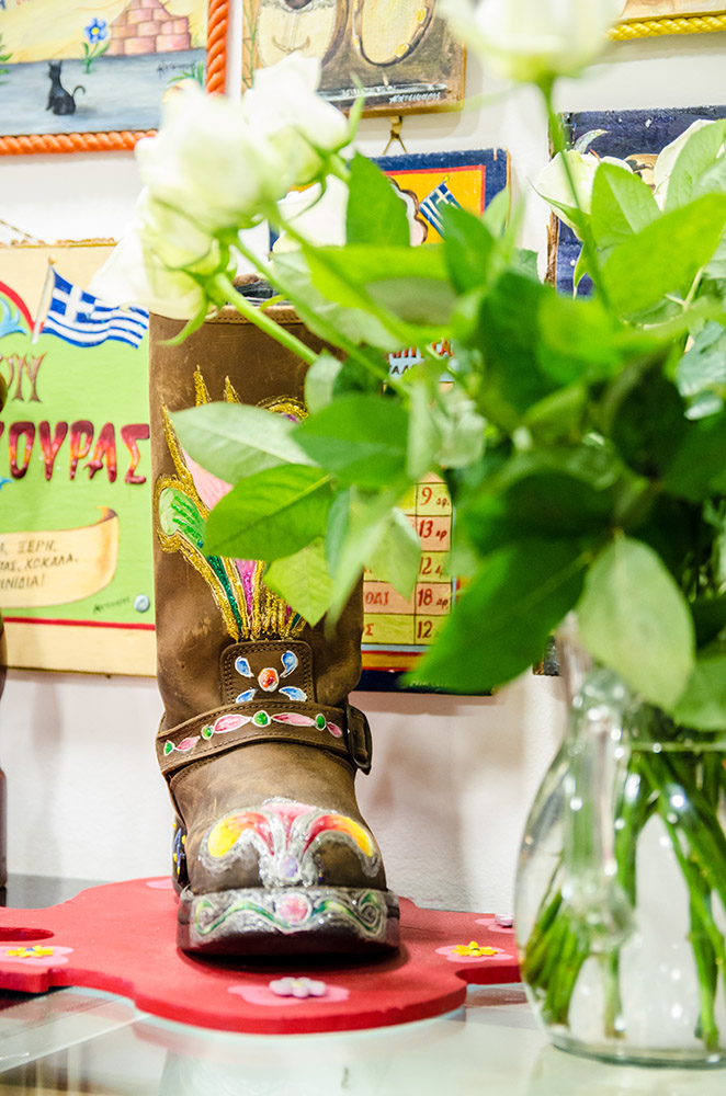 A painted folk boot holding spring flowers
