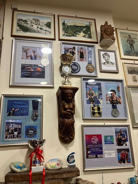 Photographs and keepsakes on the café wall