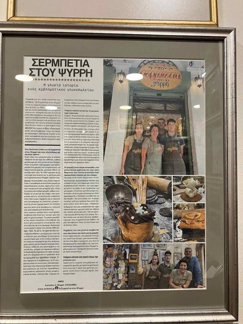 A framed newspaper feature about the sweet shop