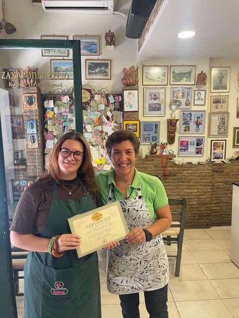 A proud moment with Maria and a workshop certificate